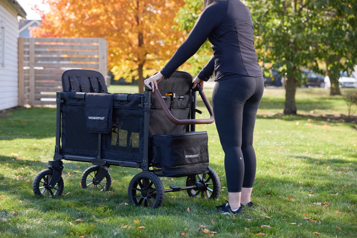 Mom uses Adjustable Faux Leather Handlebar on a W4 Luxe Pro Stroller Wagon